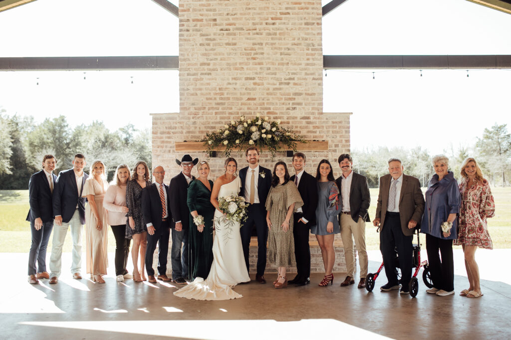 Natural posing in family group shot at wedding