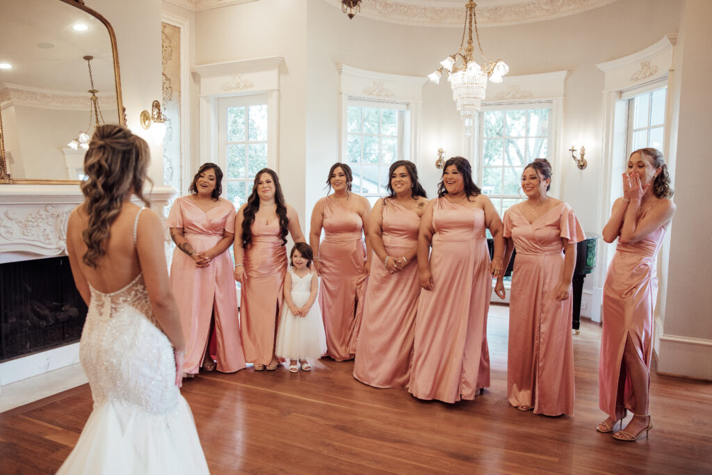 Bridesmaid shot looking at bride