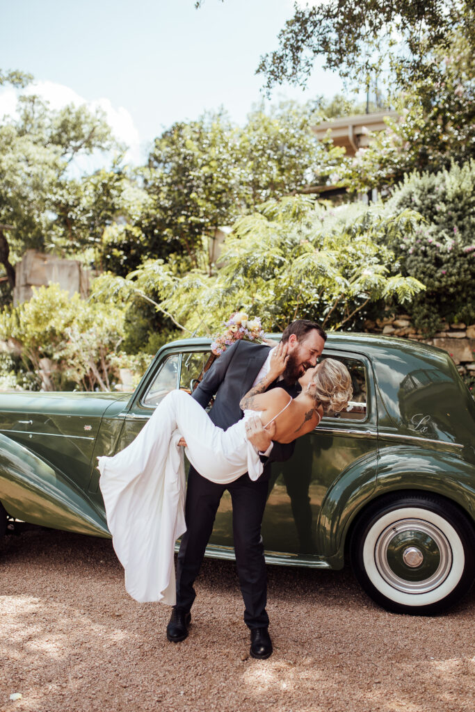 Groom holding bride