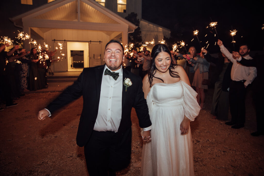 Candid shot of bride and groom leaving wedding reception