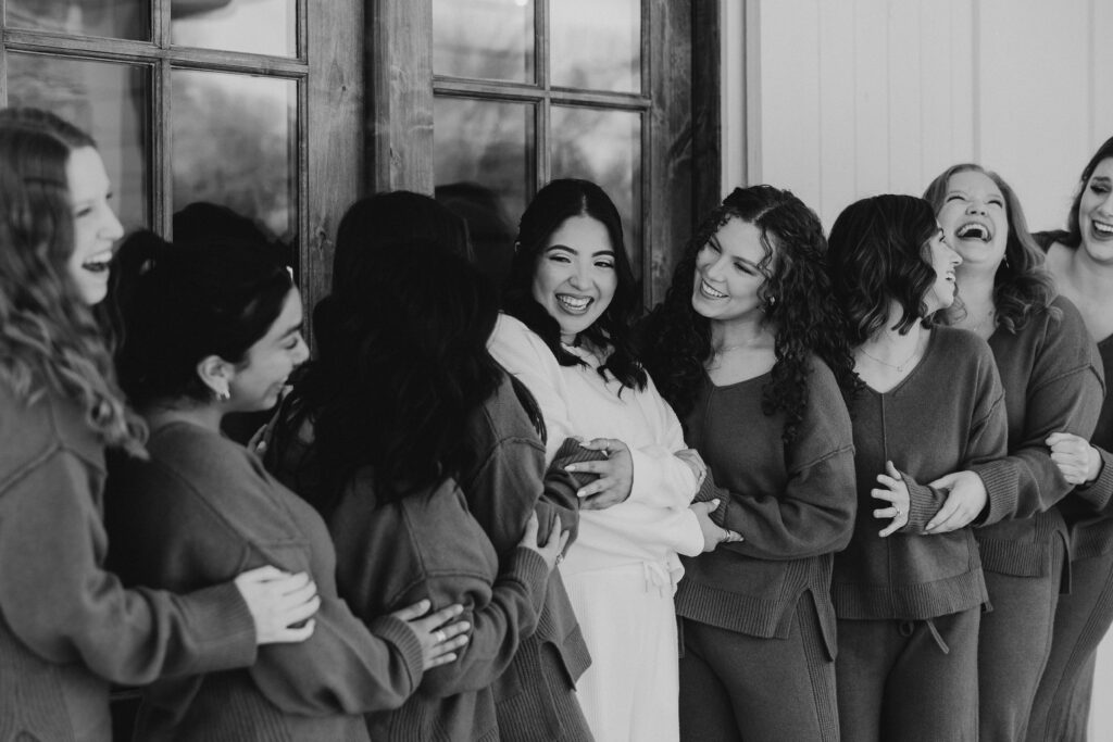 Bridal party encircles bride